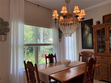 Beautifully maintained home in Solivita. Gorgeous landscaping on Stonegate Golf Club in Florida - for sale on GolfHomes.com, golf home, golf lot