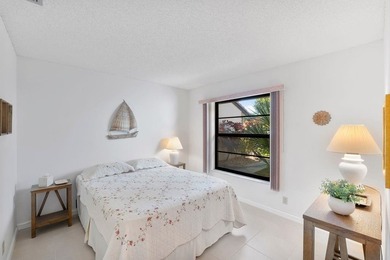 Furnished 2-bed, 2-bath waterfront villa in The Lakes of Deer on Deer Creek Golf Club in Florida - for sale on GolfHomes.com, golf home, golf lot