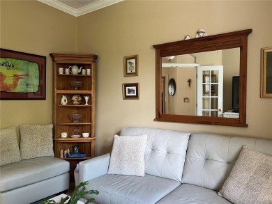 Beautifully maintained home in Solivita. Gorgeous landscaping on Stonegate Golf Club in Florida - for sale on GolfHomes.com, golf home, golf lot