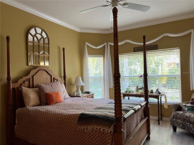Beautifully maintained home in Solivita. Gorgeous landscaping on Stonegate Golf Club in Florida - for sale on GolfHomes.com, golf home, golf lot