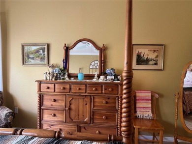Beautifully maintained home in Solivita. Gorgeous landscaping on Stonegate Golf Club in Florida - for sale on GolfHomes.com, golf home, golf lot