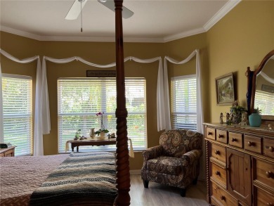 Beautifully maintained home in Solivita. Gorgeous landscaping on Stonegate Golf Club in Florida - for sale on GolfHomes.com, golf home, golf lot
