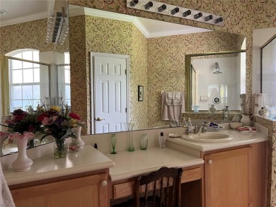 Beautifully maintained home in Solivita. Gorgeous landscaping on Stonegate Golf Club in Florida - for sale on GolfHomes.com, golf home, golf lot