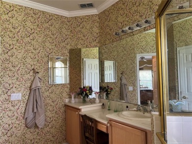 Beautifully maintained home in Solivita. Gorgeous landscaping on Stonegate Golf Club in Florida - for sale on GolfHomes.com, golf home, golf lot
