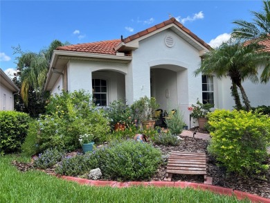 Beautifully maintained home in Solivita. Gorgeous landscaping on Stonegate Golf Club in Florida - for sale on GolfHomes.com, golf home, golf lot