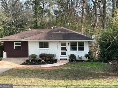 Welcome home! This beautifully remodeled 3-bedroom, 2 bath home on East Lake Golf Club in Georgia - for sale on GolfHomes.com, golf home, golf lot