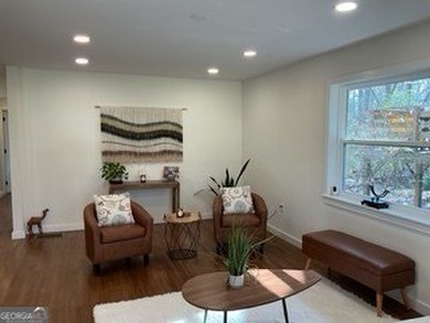 Welcome home! This beautifully remodeled 3-bedroom, 2 bath home on East Lake Golf Club in Georgia - for sale on GolfHomes.com, golf home, golf lot