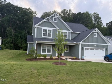 This lovely 5 bedroom, 3 full baths with a first floor primary on Olde Liberty Golf and Country Club in North Carolina - for sale on GolfHomes.com, golf home, golf lot