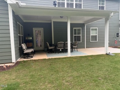 This lovely 5 bedroom, 3 full baths with a first floor primary on Olde Liberty Golf and Country Club in North Carolina - for sale on GolfHomes.com, golf home, golf lot