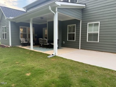 This lovely 5 bedroom, 3 full baths with a first floor primary on Olde Liberty Golf and Country Club in North Carolina - for sale on GolfHomes.com, golf home, golf lot