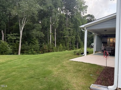 This lovely 5 bedroom, 3 full baths with a first floor primary on Olde Liberty Golf and Country Club in North Carolina - for sale on GolfHomes.com, golf home, golf lot
