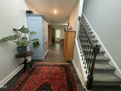 This lovely 5 bedroom, 3 full baths with a first floor primary on Olde Liberty Golf and Country Club in North Carolina - for sale on GolfHomes.com, golf home, golf lot