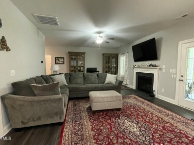 This lovely 5 bedroom, 3 full baths with a first floor primary on Olde Liberty Golf and Country Club in North Carolina - for sale on GolfHomes.com, golf home, golf lot