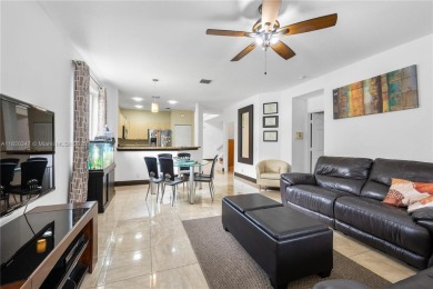 Beautifully maintained 5 bed, 2.5 bath home in the guard-gated on Weston Hills Country Club in Florida - for sale on GolfHomes.com, golf home, golf lot