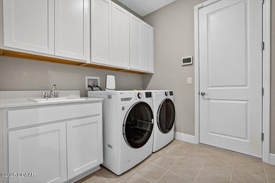 1033 Scramble Drive is a 2023 Meritage Home offering an on LPGA International Golf Course in Florida - for sale on GolfHomes.com, golf home, golf lot