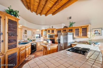 One of a kind Eddie Chavez home featuring original Pueblo style on New Mexico St Univ Golf Course in New Mexico - for sale on GolfHomes.com, golf home, golf lot