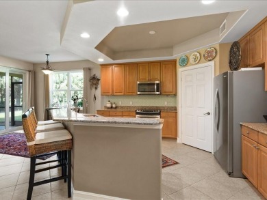 THIS BEAUTIFULLY APPOINTED THREE BEDROOM TWO BATH COACH HOME IS on Hammock Bay in Florida - for sale on GolfHomes.com, golf home, golf lot