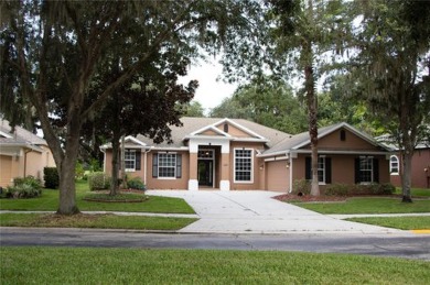 A beautiful courtyard drive welcomes you to this exquisite on North Shore Golf Club in Florida - for sale on GolfHomes.com, golf home, golf lot