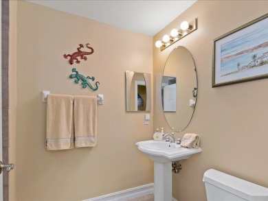 THIS BEAUTIFULLY APPOINTED THREE BEDROOM TWO BATH COACH HOME IS on Hammock Bay in Florida - for sale on GolfHomes.com, golf home, golf lot