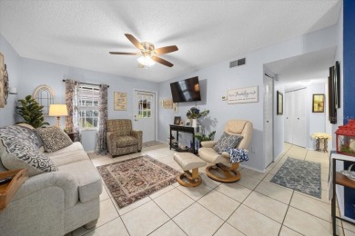Discover the charm of this beautifully updated 2-bedroom on Country Club At Silver Springs Shores in Florida - for sale on GolfHomes.com, golf home, golf lot
