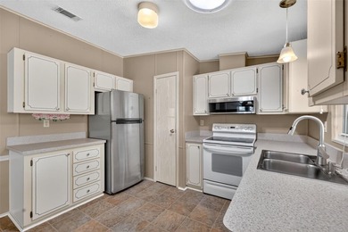 One or more photo(s) has been virtually staged. Discover the on El Diablo Executive Golf Course in Florida - for sale on GolfHomes.com, golf home, golf lot