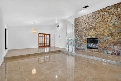 Stunning 4BR/2BA waterfront pool home in prestigious Country on  in Florida - for sale on GolfHomes.com, golf home, golf lot