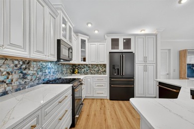 STUNNING, GOLF FRONT and WATER VIEW, 3/2 BLOCK and STUCCO on The Links of Spruce Creek in Florida - for sale on GolfHomes.com, golf home, golf lot