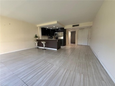 Discover your slice of paradise in this charming 1-bedroom on Quail Run Golf Club In Naples in Florida - for sale on GolfHomes.com, golf home, golf lot