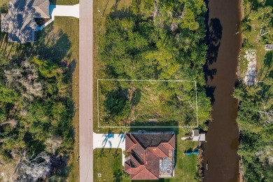 Discover the perfect canvas for your dream home! This waterfront on Sabal Trace Golf and Country Club in Florida - for sale on GolfHomes.com, golf home, golf lot