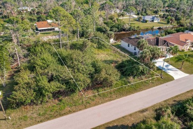 Discover the perfect canvas for your dream home! This waterfront on Sabal Trace Golf and Country Club in Florida - for sale on GolfHomes.com, golf home, golf lot