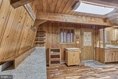 Discover the perfect blend of rustic charm and modern luxury in on Alpine Lake Resort in West Virginia - for sale on GolfHomes.com, golf home, golf lot