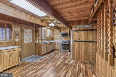 Discover the perfect blend of rustic charm and modern luxury in on Alpine Lake Resort in West Virginia - for sale on GolfHomes.com, golf home, golf lot
