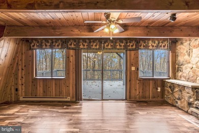 Discover the perfect blend of rustic charm and modern luxury in on Alpine Lake Resort in West Virginia - for sale on GolfHomes.com, golf home, golf lot