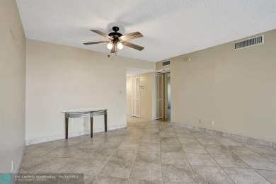 Discover your dream home in this beautiful 2BR, 2BA condo on Palm-Aire Country Club and Resort - Palms in Florida - for sale on GolfHomes.com, golf home, golf lot