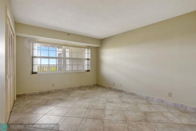 Discover your dream home in this beautiful 2BR, 2BA condo on Palm-Aire Country Club and Resort - Palms in Florida - for sale on GolfHomes.com, golf home, golf lot