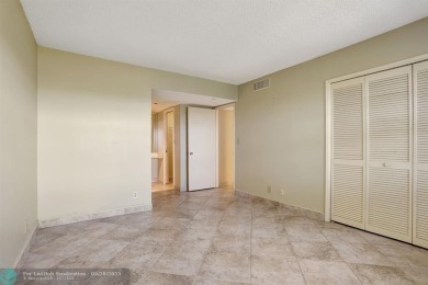 Discover your dream home in this beautiful 2BR, 2BA condo on Palm-Aire Country Club and Resort - Palms in Florida - for sale on GolfHomes.com, golf home, golf lot