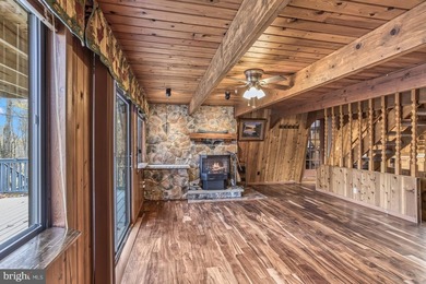 Discover the perfect blend of rustic charm and modern luxury in on Alpine Lake Resort in West Virginia - for sale on GolfHomes.com, golf home, golf lot