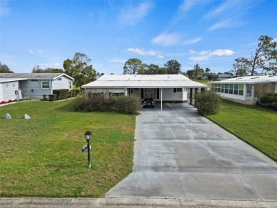 Wake up to breathtaking golf course views and embrace the active on Zellwood Station Country Club in Florida - for sale on GolfHomes.com, golf home, golf lot