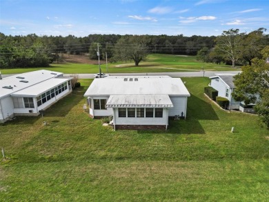 Wake up to breathtaking golf course views and embrace the active on Zellwood Station Country Club in Florida - for sale on GolfHomes.com, golf home, golf lot