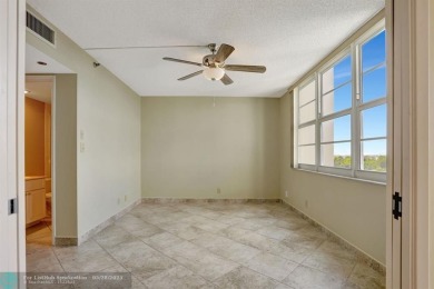 Discover your dream home in this beautiful 2BR, 2BA condo on Palm-Aire Country Club and Resort - Palms in Florida - for sale on GolfHomes.com, golf home, golf lot