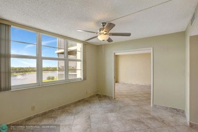 Discover your dream home in this beautiful 2BR, 2BA condo on Palm-Aire Country Club and Resort - Palms in Florida - for sale on GolfHomes.com, golf home, golf lot