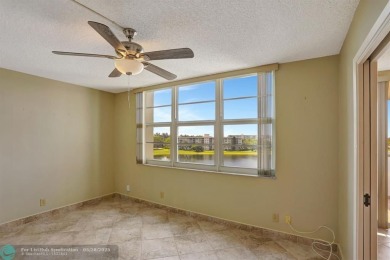 Discover your dream home in this beautiful 2BR, 2BA condo on Palm-Aire Country Club and Resort - Palms in Florida - for sale on GolfHomes.com, golf home, golf lot