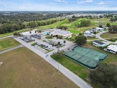 Wake up to breathtaking golf course views and embrace the active on Zellwood Station Country Club in Florida - for sale on GolfHomes.com, golf home, golf lot