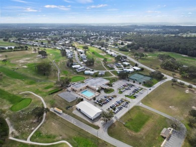 Wake up to breathtaking golf course views and embrace the active on Zellwood Station Country Club in Florida - for sale on GolfHomes.com, golf home, golf lot