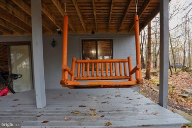 Discover the perfect blend of rustic charm and modern luxury in on Alpine Lake Resort in West Virginia - for sale on GolfHomes.com, golf home, golf lot