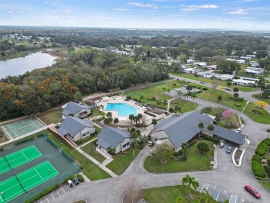 Wake up to breathtaking golf course views and embrace the active on Zellwood Station Country Club in Florida - for sale on GolfHomes.com, golf home, golf lot