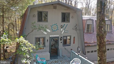 Discover the perfect blend of rustic charm and modern luxury in on Alpine Lake Resort in West Virginia - for sale on GolfHomes.com, golf home, golf lot