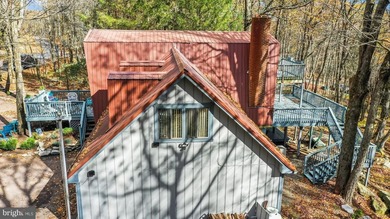 Discover the perfect blend of rustic charm and modern luxury in on Alpine Lake Resort in West Virginia - for sale on GolfHomes.com, golf home, golf lot