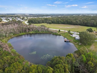 Wake up to breathtaking golf course views and embrace the active on Zellwood Station Country Club in Florida - for sale on GolfHomes.com, golf home, golf lot