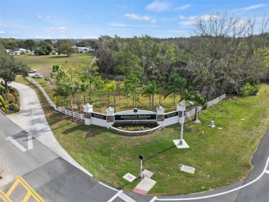 Wake up to breathtaking golf course views and embrace the active on Zellwood Station Country Club in Florida - for sale on GolfHomes.com, golf home, golf lot